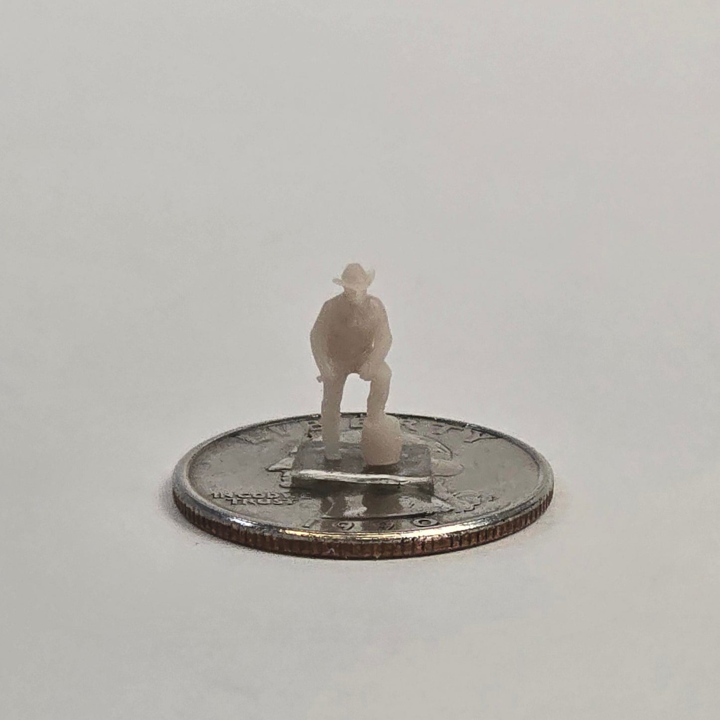 N Scale Cowboy – Foot on Barrel | Unpainted Western Miniature for Dioramas & Train Scenes