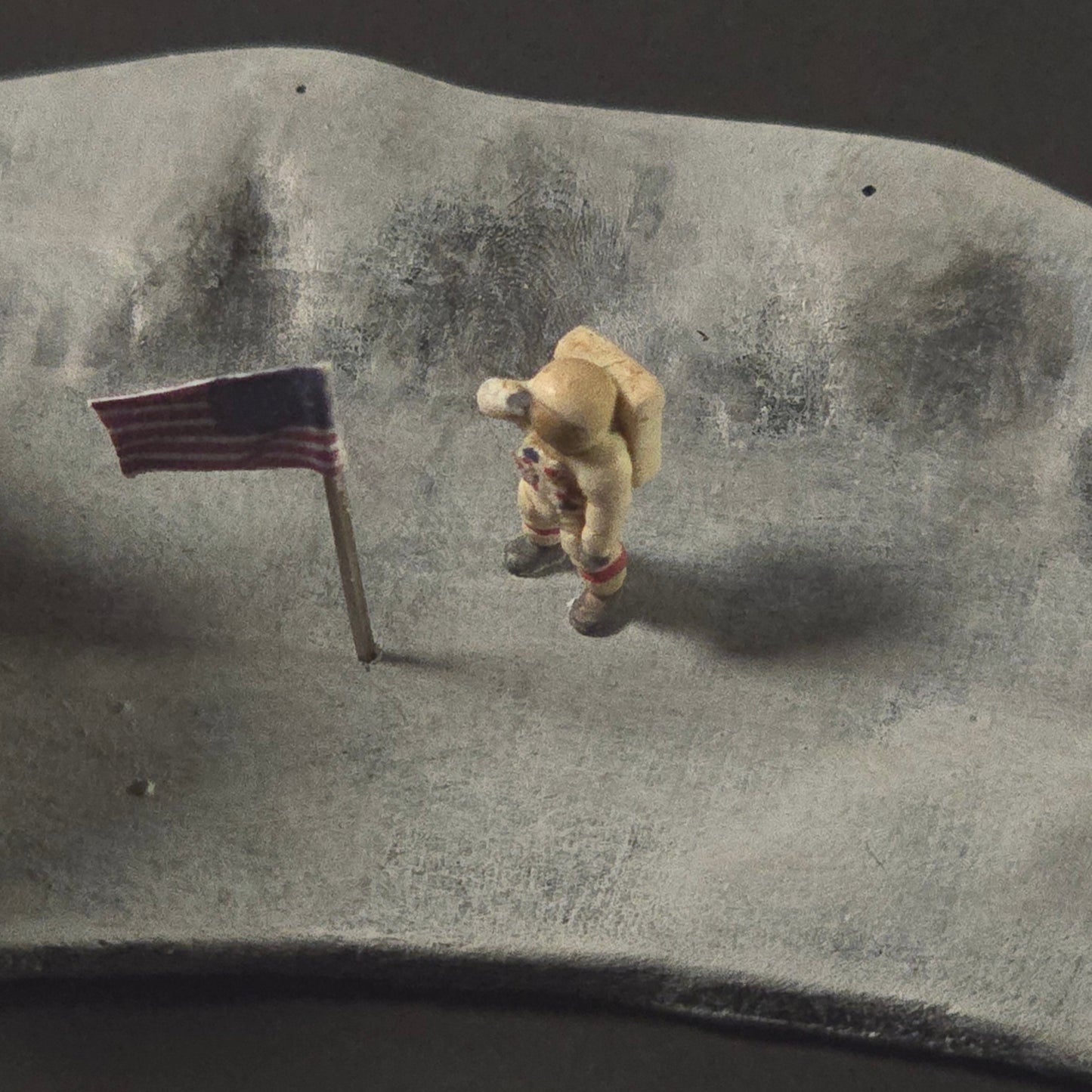 “Complete Apollo lunar mission diorama featuring painted and weathered lunar lander, rover, astronauts, tools, and flag displayed on a sculpted lunar base.”
