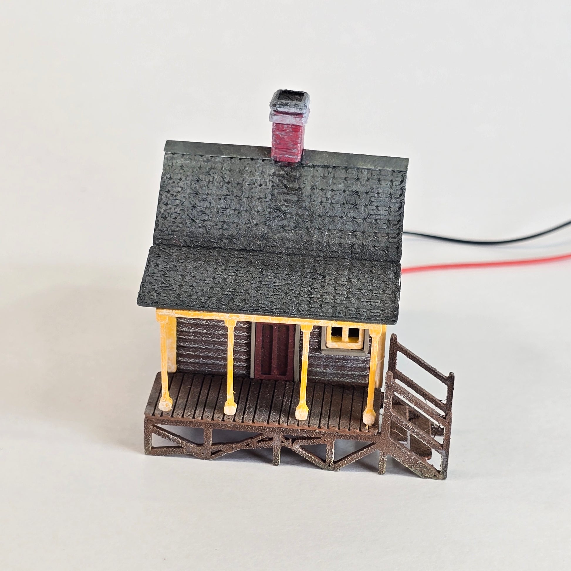 Small mechanical model with a textured surface on a white background