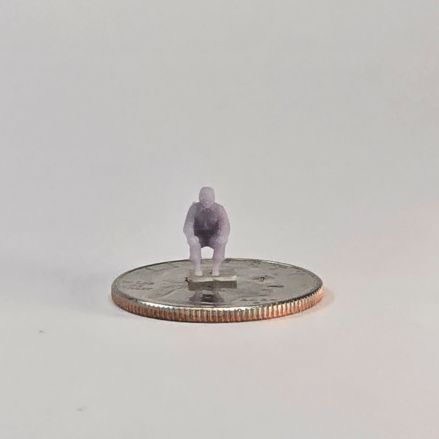 N Scale 12mm Seated Pilot Figure – Unpainted Miniature for Aircraft Dioramas