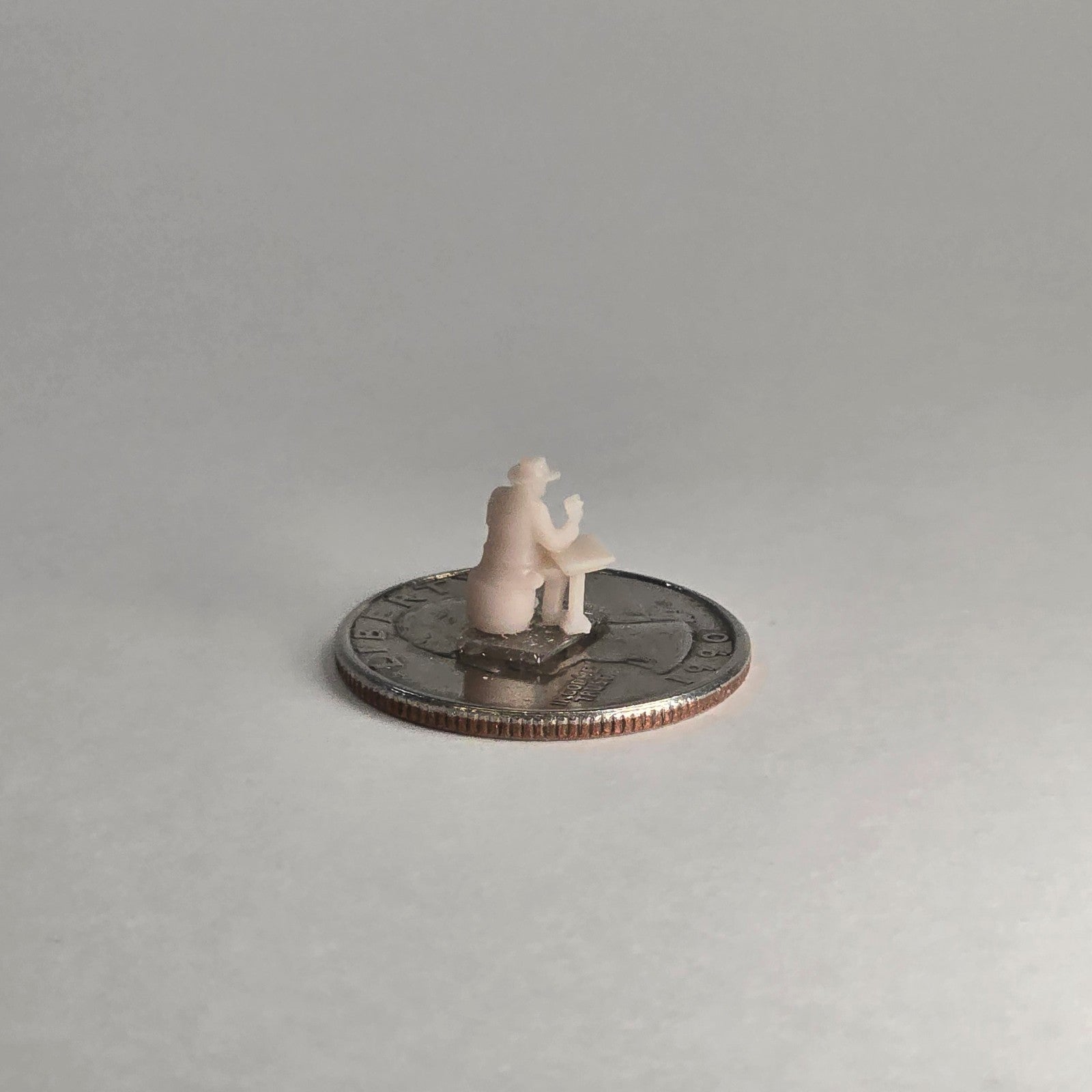 N Scale 12mm Gambler at Table – Unpainted Seated Figure for Western Dioramas