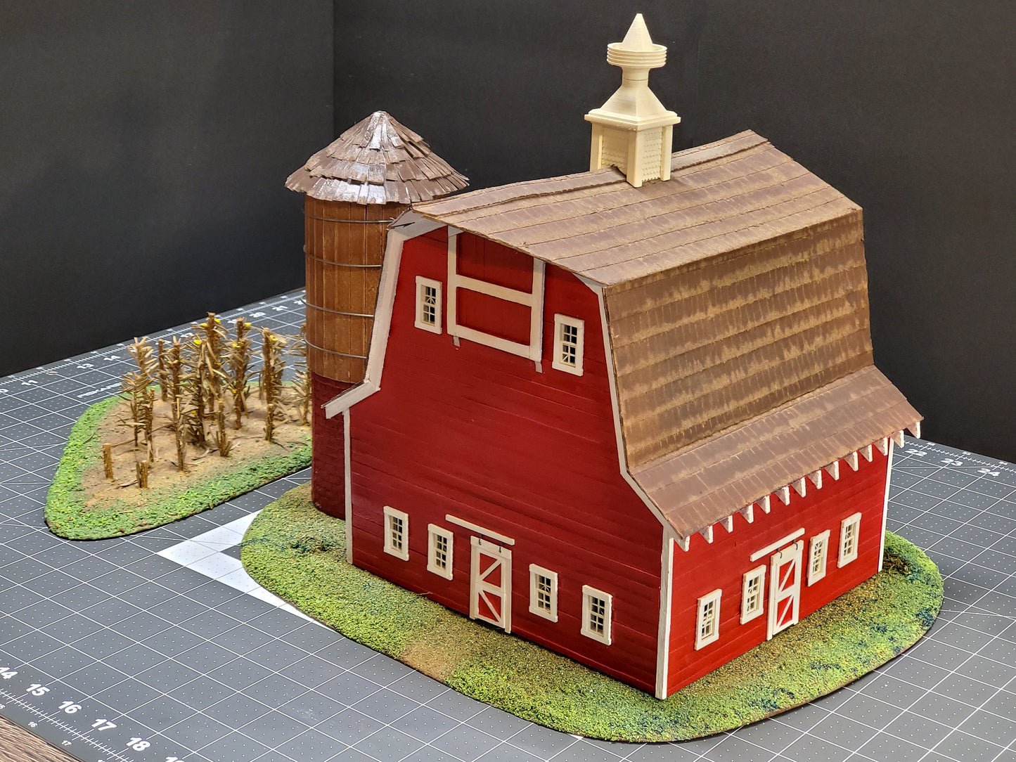 O-scale Red Barn made from real wood, a realistic silo, and a cornfield landscape. Ready-Built to install on your Model train layout.