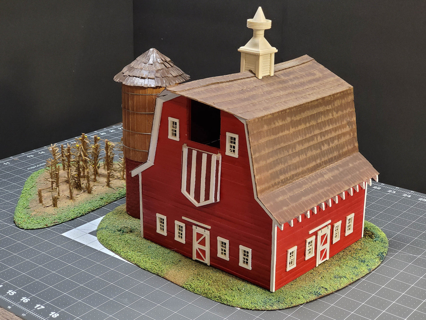 O-scale Red Barn made from real wood, a realistic silo, and a cornfield landscape. Ready-Built to install on your Model train layout.