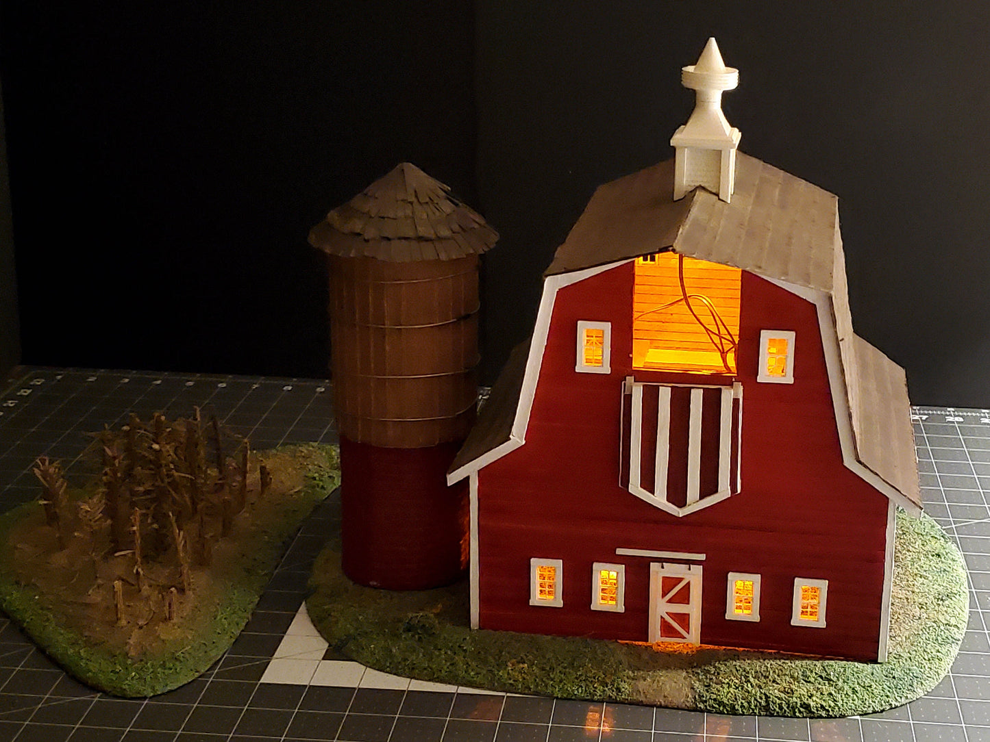 O-scale Red Barn made from real wood, a realistic silo, and a cornfield landscape. Ready-Built to install on your Model train layout.